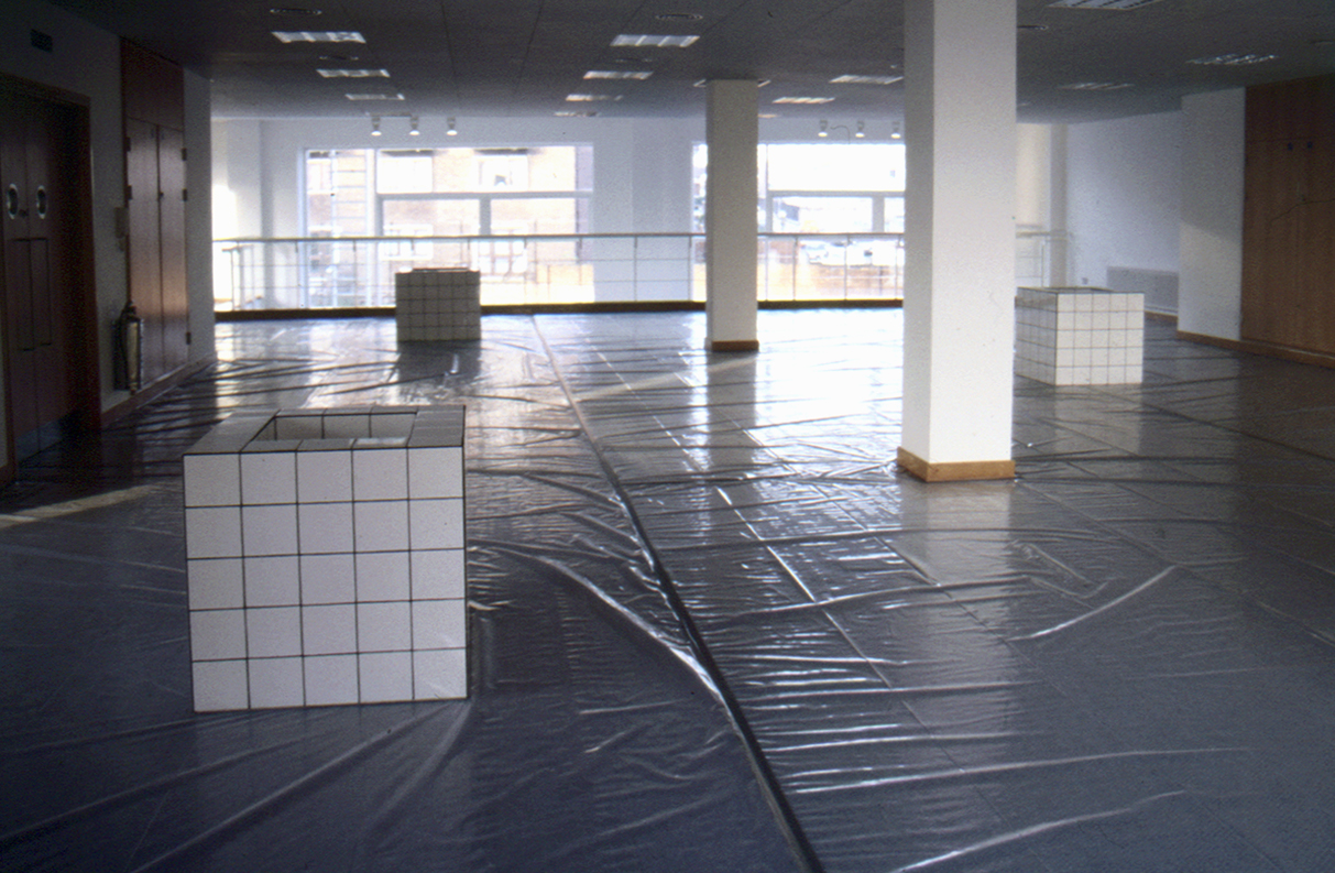 White-tiled, cuboid sculptures containing canal water