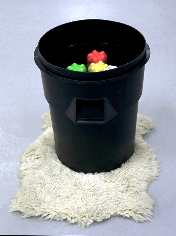 Nature / Culture, 1997. Plastic bin, plastic bottles, flourescent paint, water and sheepskin rug