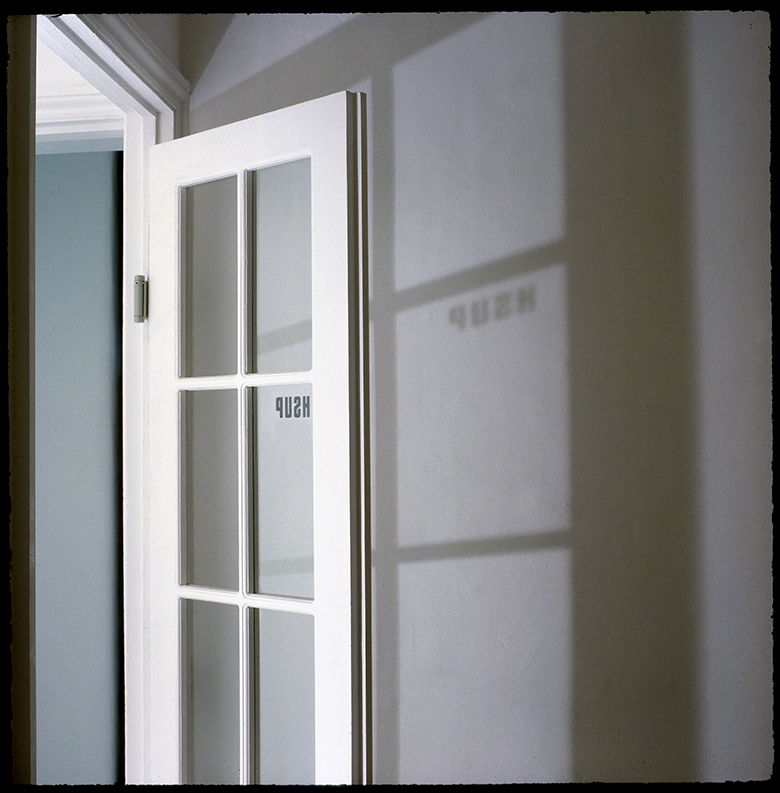 Paradoxical 'PUSH' sign on double swing door